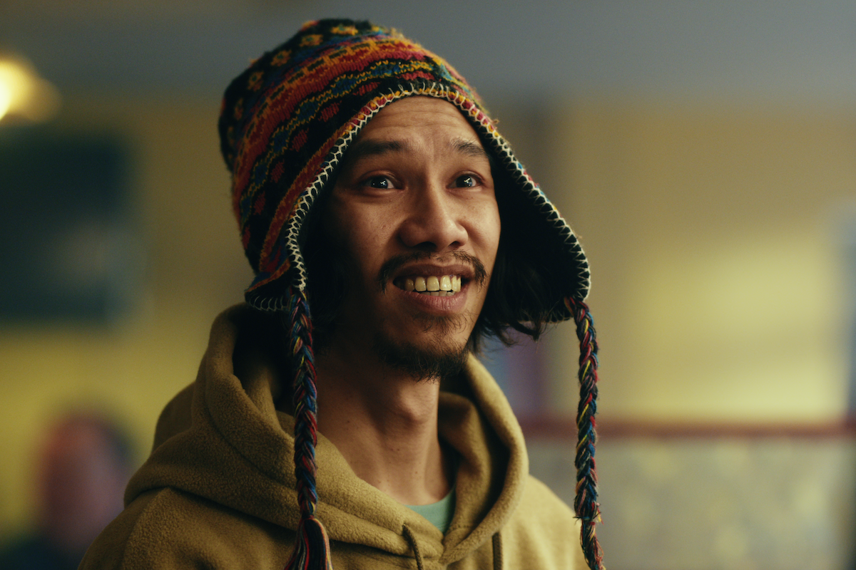 Michael Vu as Jimmy Chang wears a beanie hat in season 1 of ‘The Gentlemen’