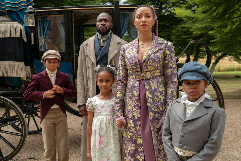  James Bryan as Nicky Mondrich, Martins Imhangbe as Will Mondrich, Ariella Warburton as Daisy Mondrich, Emma Naomi as Alice Mondrich, and Elias Amos as John Mondrich stand outside of a carriage in season 3 of 'Bridgerton'