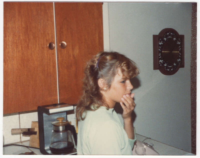 Pamela standing in the kitchen.