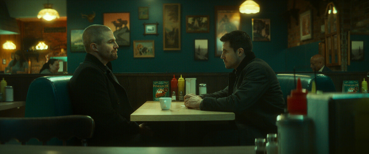 Stephen Amell as Garrett, Robbie Amell as Connor have a conversation in a diner in ‘Code 8 Part II.’