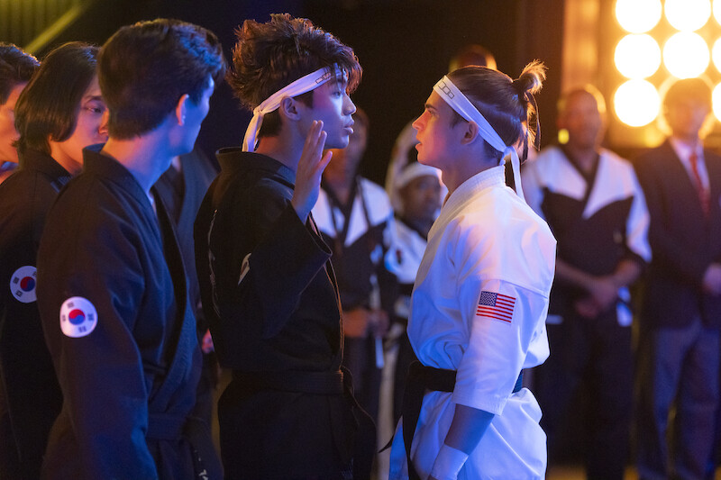Brandon H. Lee as Kwon and Tanner Buchanan as Robby Keene face off in Season 6, Part 2 of 'Cobra Kai'