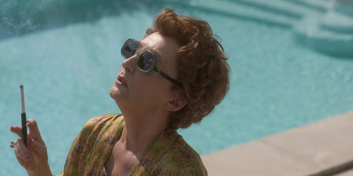 Princess Margaret smoking a cigarette next to a pool.