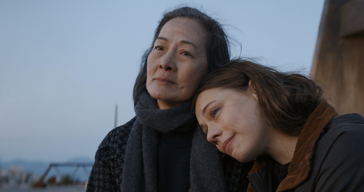 Actress Marlo Kelly places her head on actress Rosalind Chao's left shoulder. A still from episode 7 of '3 Body Problem'