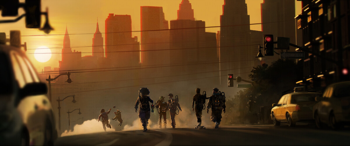 A group of costumed or monstrous figures walk down a city street at sunset with skyscrapers in the background, cars parked along the sides, and a dramatic orange sky creating a moody, post-apocalyptic atmosphere.