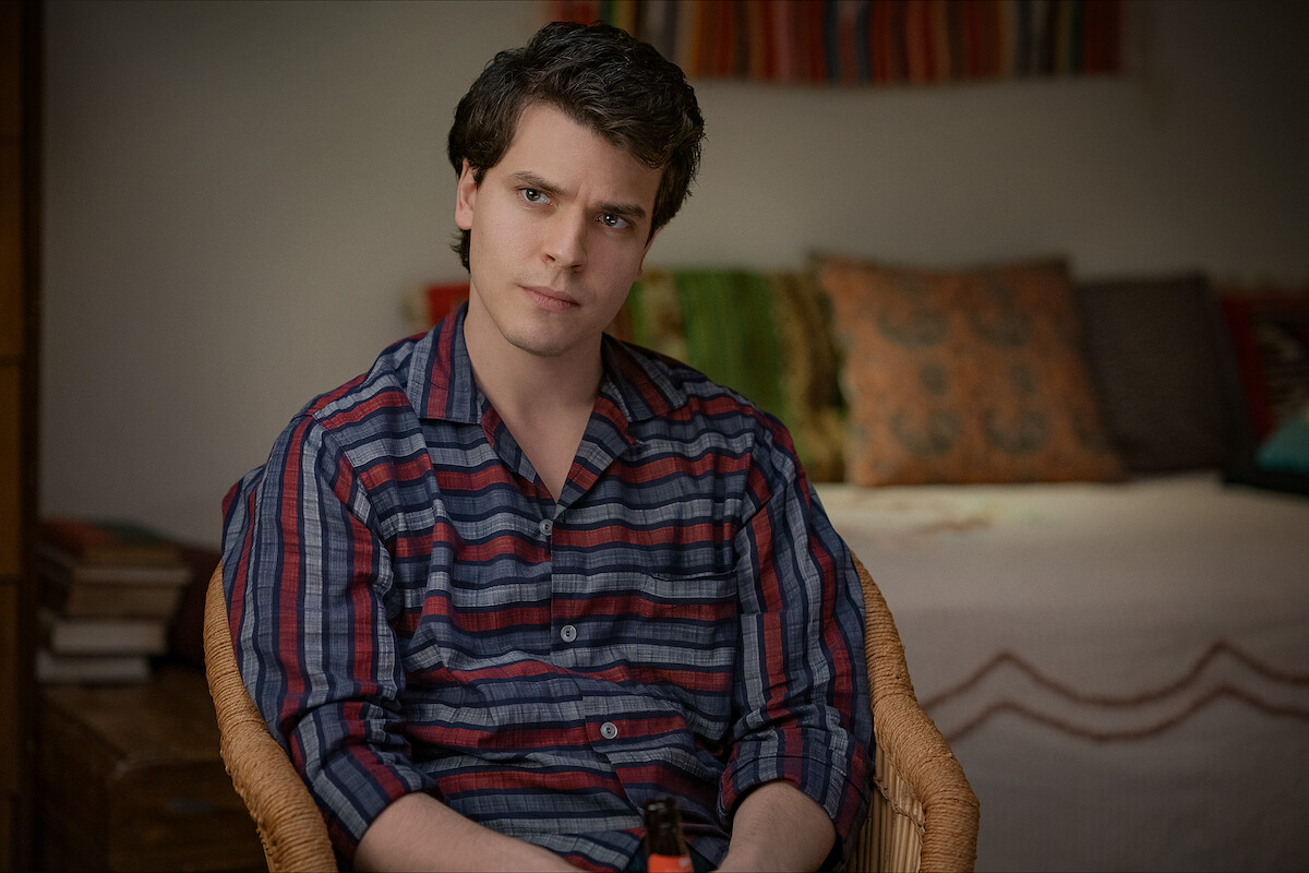 Gus Halper as Tom Kahn sits with a concerned expression in ‘Rustin.’