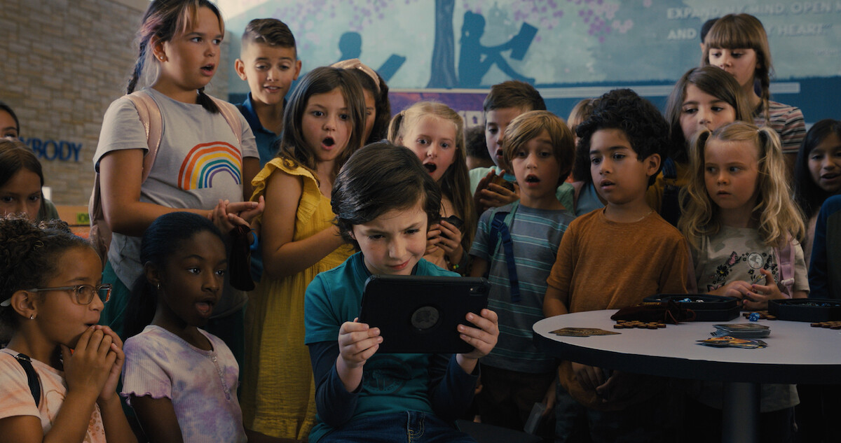 Connor Esterson as Tony in Spy Kids: 'Armageddon' shows off his favorite videogame to his class. 