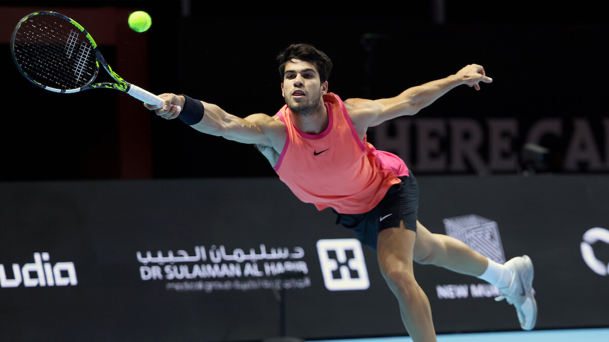 Carlos Alcaraz hitting an outstretched forehand shot during The 2024 6 Kings Slam