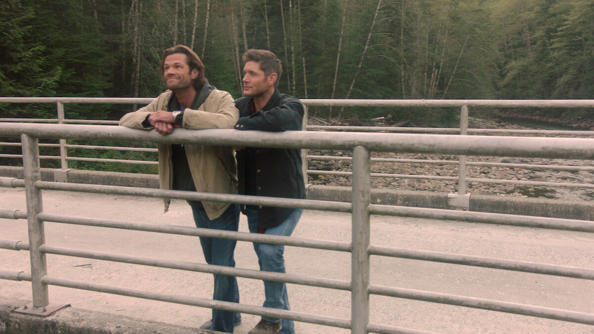 2 Men standing on a bridge