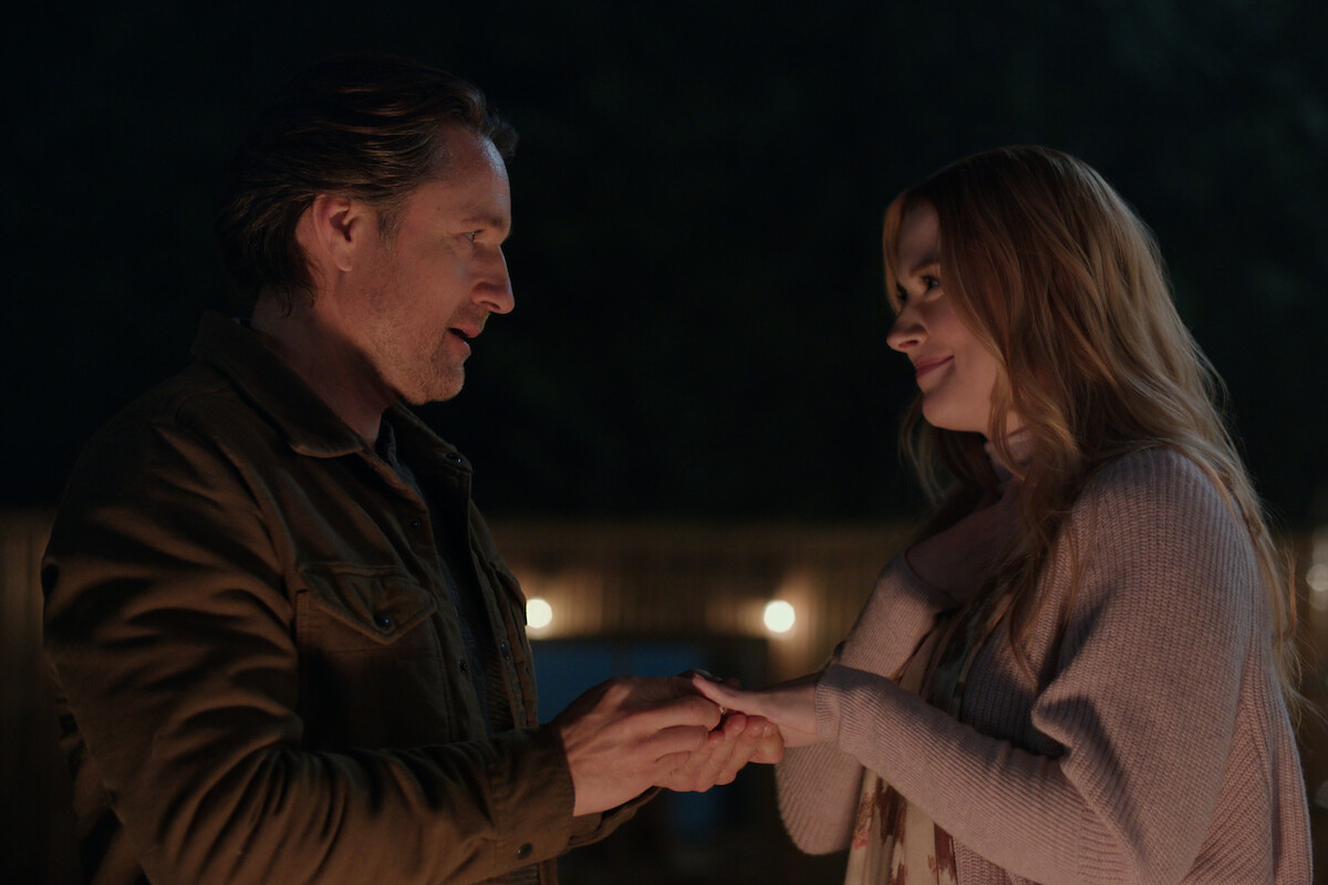 Martin Henderson as Jack Sheridan puts a ring on Alexandra Breckenridge as Mel Monroe’s finger in Season 4 of ‘Virgin River.’
