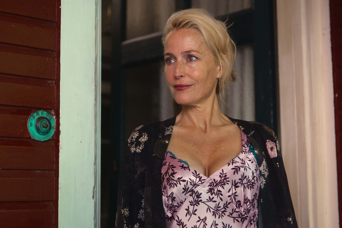 Gillian Anderson as Jean Milburn stands on her porch in Season 4 of ‘Sex Education’