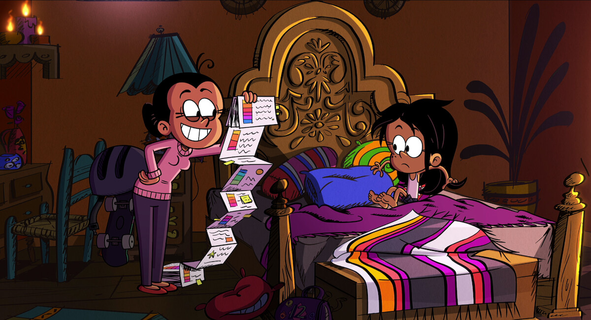 In an image from the animated film ‘The Casagrades Movie,’ the character Maria stands holding a long piece of paper next to her daughter.