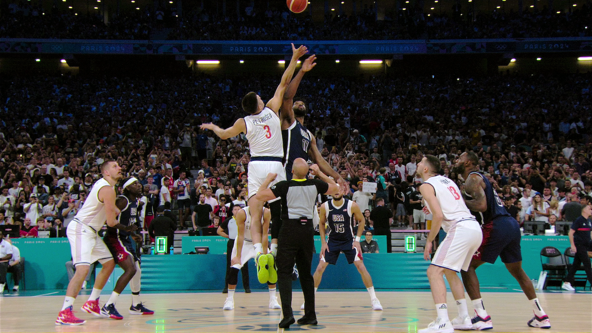 USA and Serbia Basketball Men's Olympic Teams during a game.