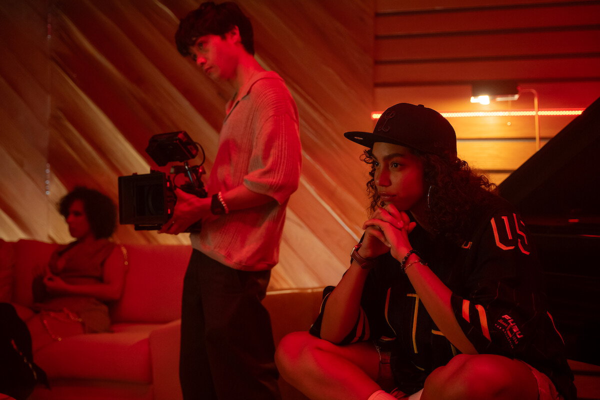Jordan Mendoza as Felix holds a video camera in Season 1 of ‘Neon.’
