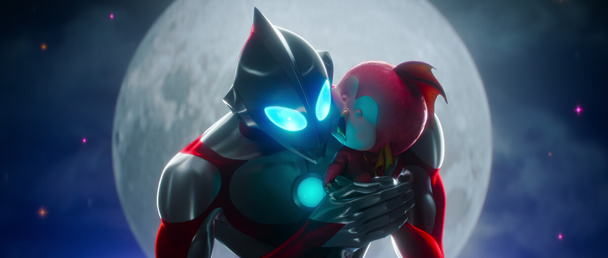 Ultraman holding a baby kaiju.