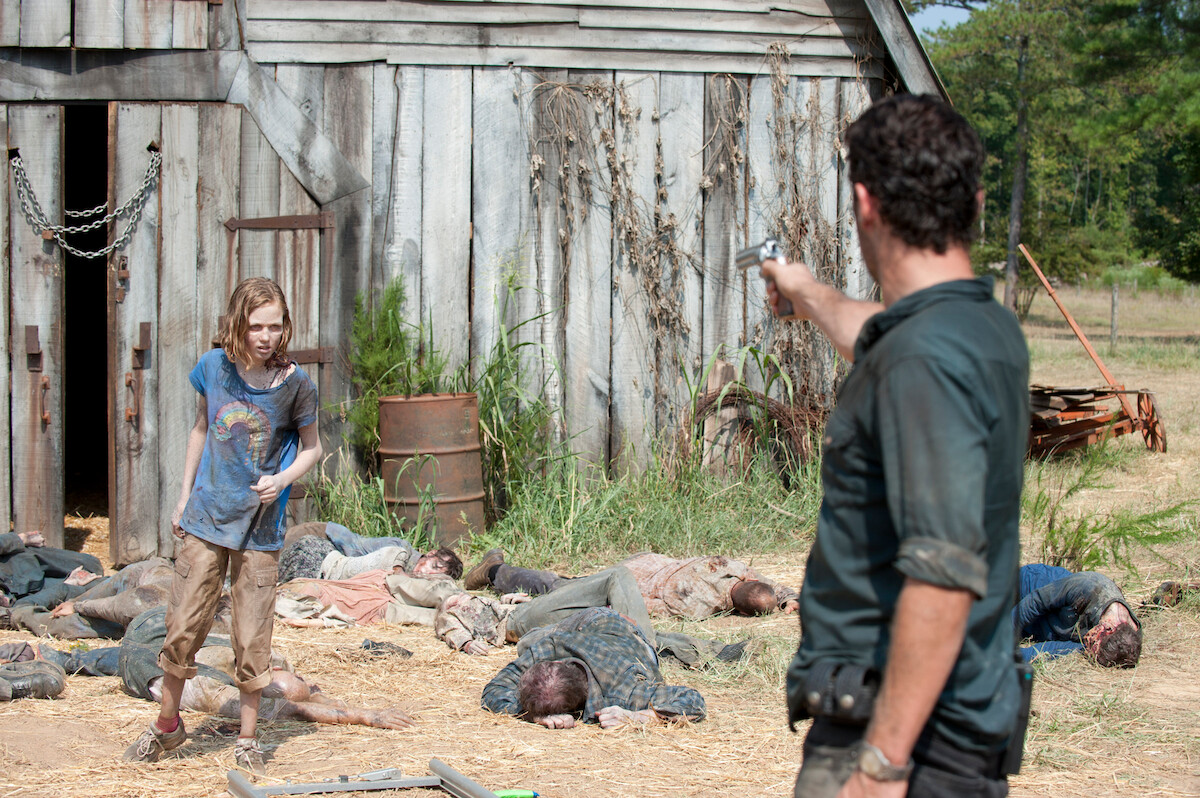 Rick shooting at a child zombie. 
