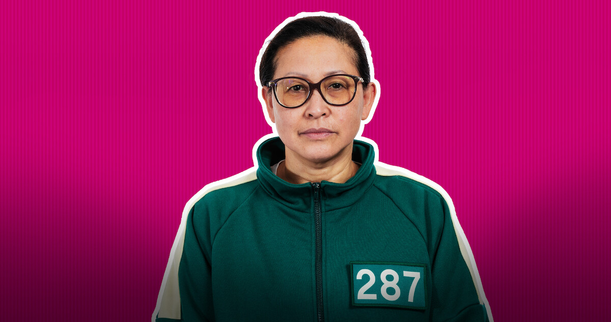 Mai (Player 287) in front of a pink background