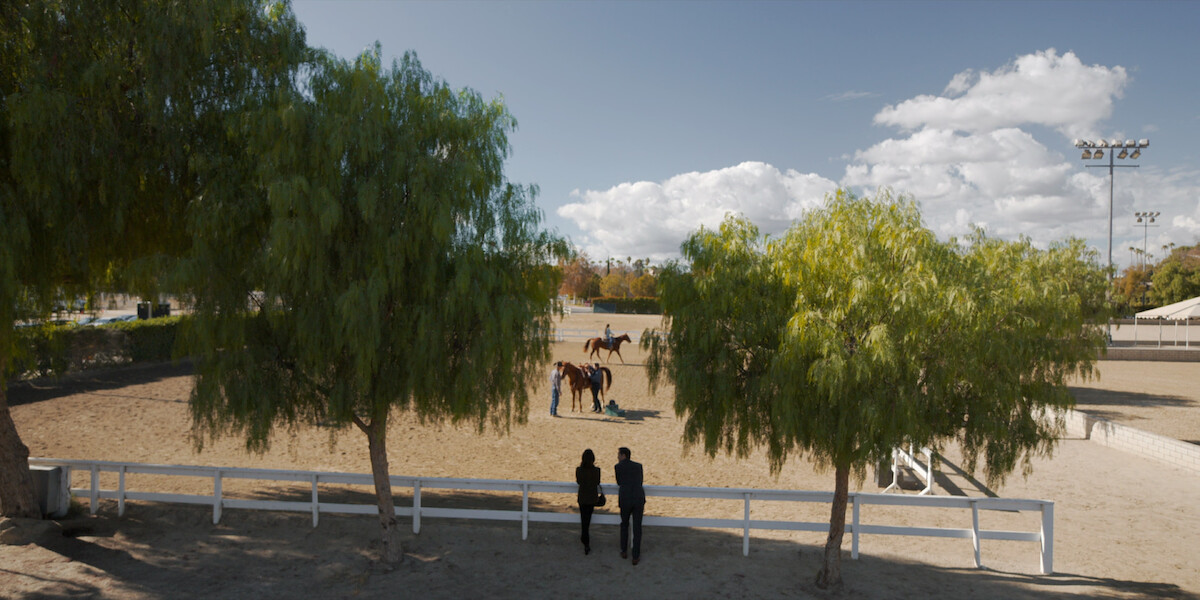 Neve Campbell as Maggie and Manuel Garcia-Rulfo as Mickey Haller at the Los Angeles Equestrian Center in ‘The Lincoln Lawyer’ Season 2
