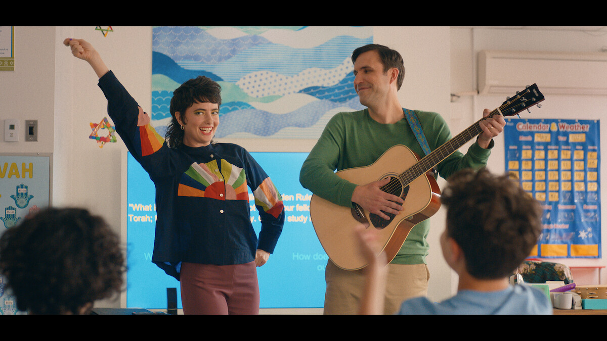 Sarah Sherman as Rabbi Rebecca and Dan Bulla as Cantor Jerry.