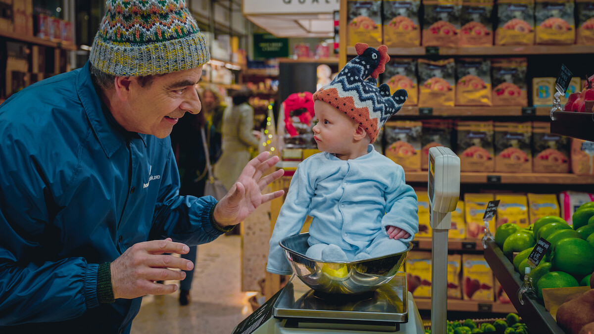 Rowan Atkinson as Trevor Bingley grocery shops with a mystery baby in ‘Man Vs Baby.’