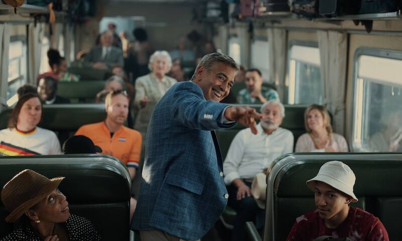 Lars Eidinger as German Cyclist, Ferdi Stofmeel as Dutch Cyclist and George Clooney as Jay Kelly in 'Jay Kelly.'