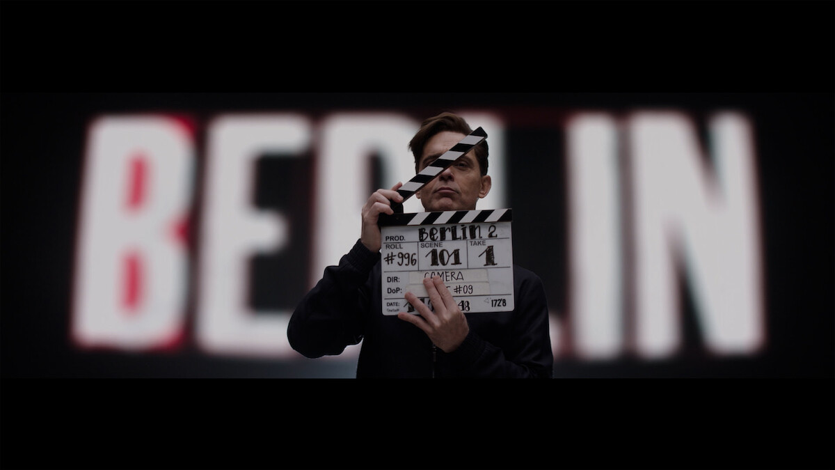 Pedro Alonso using a film clapboard