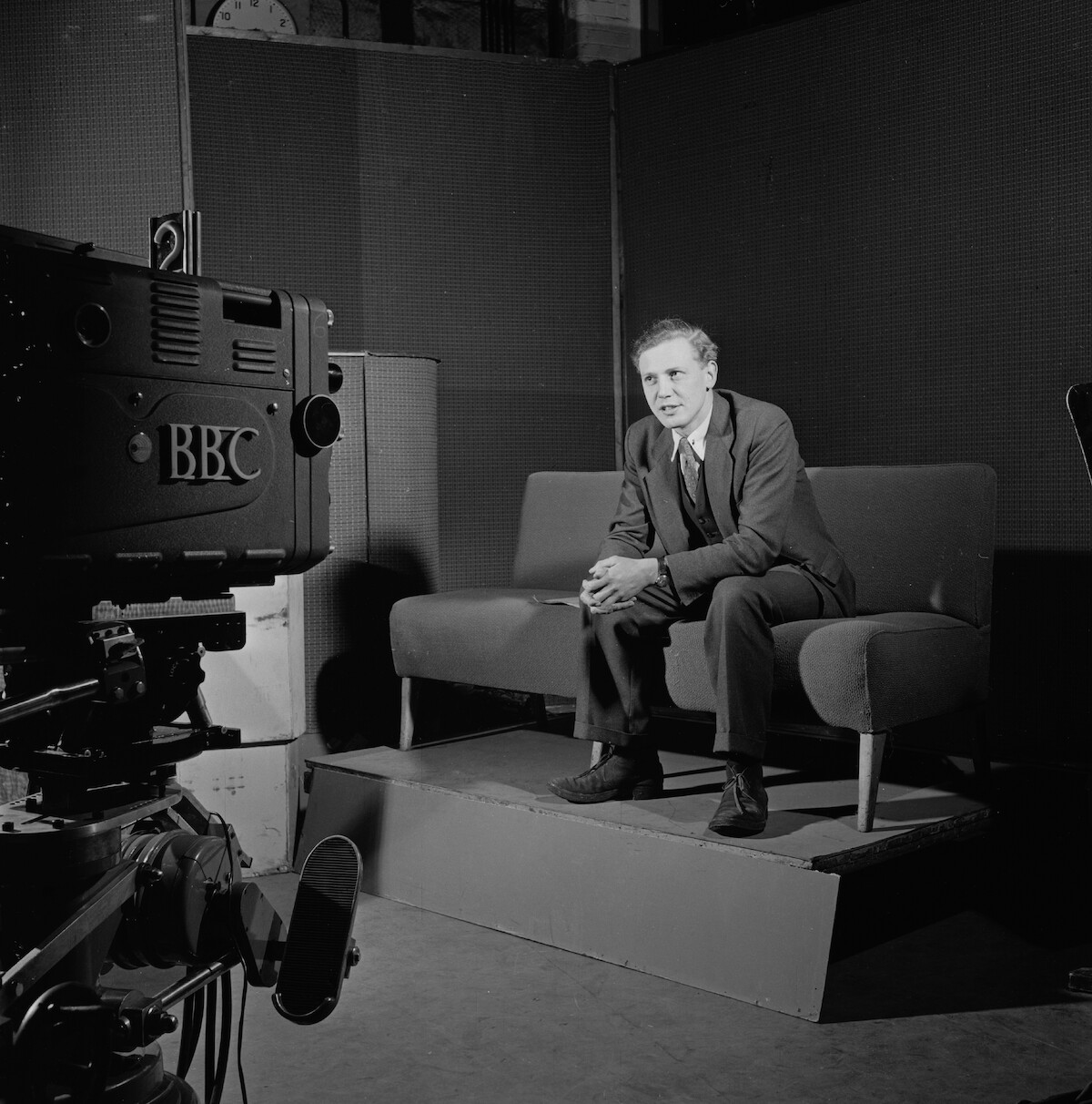 English broadcaster and naturalist David Attenborough at work in a BBC TV studio.