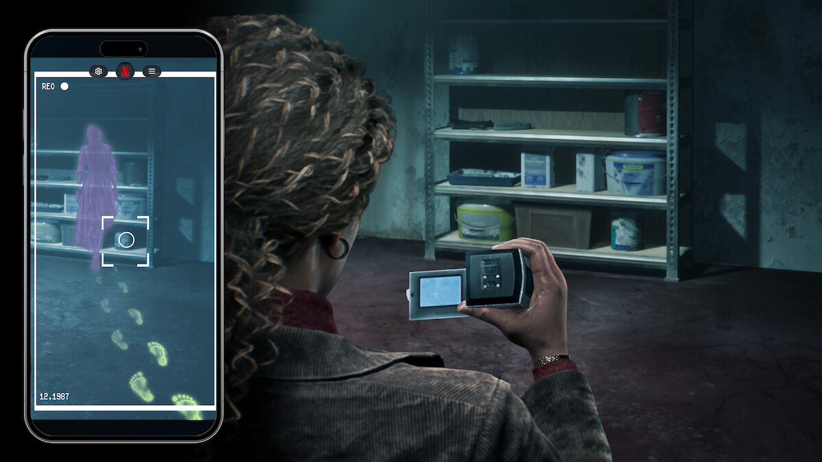 A person in a dark storage room uses a camera and phone to capture evidence, revealing ghostly footprints and a purple apparition on their screen near shelves with paint cans and cleaning supplies.