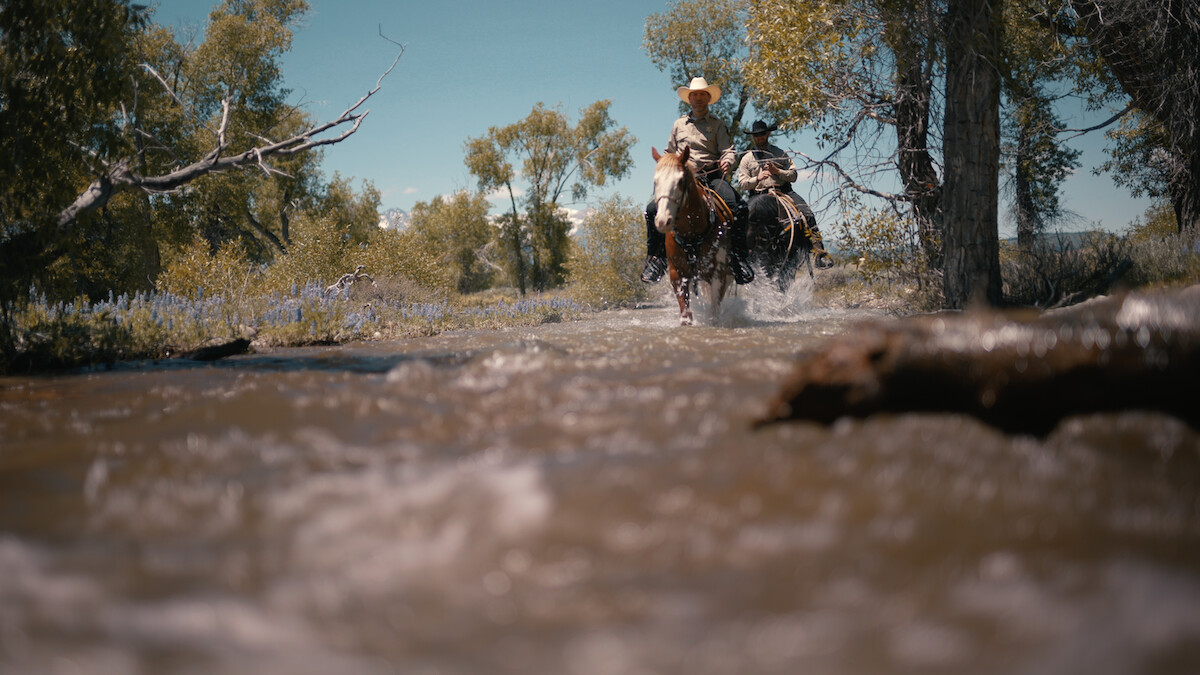 Police on horseback riding through Wyoming