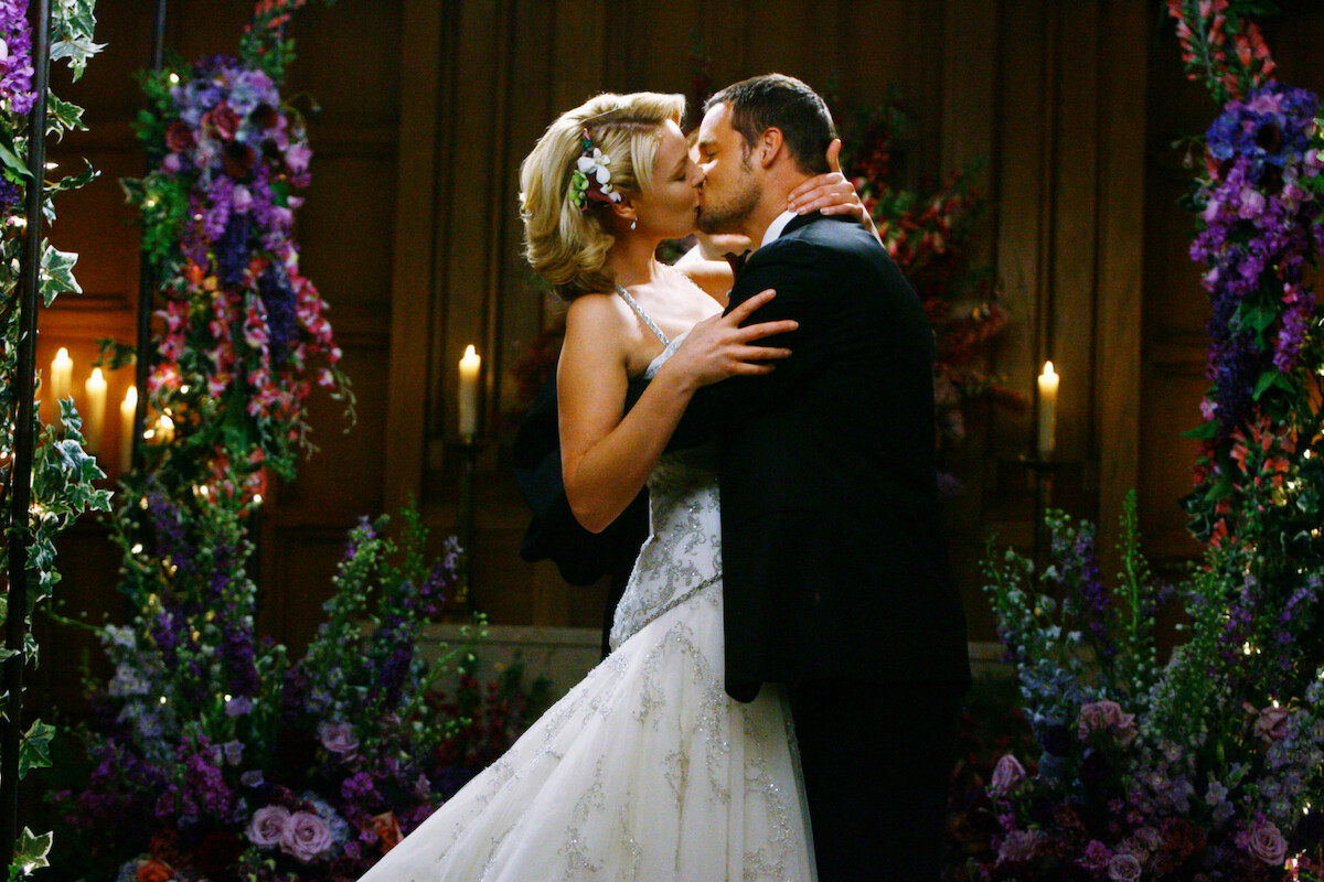 A married couple kisses for the first time. 