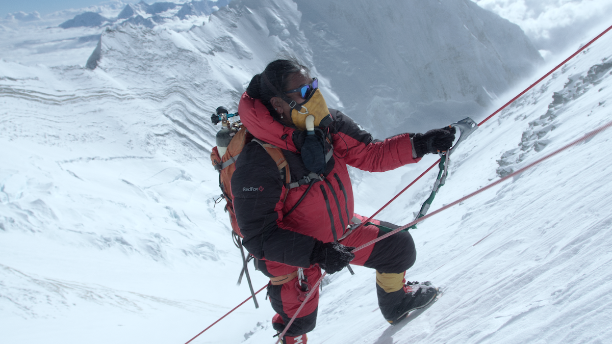 Lhakpa Sherpa climbing with an oxygen mask.
