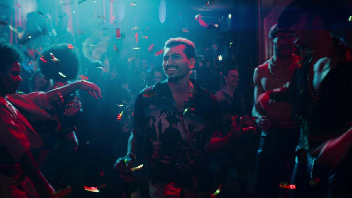 Nabhaan Rizwan as Dionysus walks through a club in Season 1 of ‘Kaos’