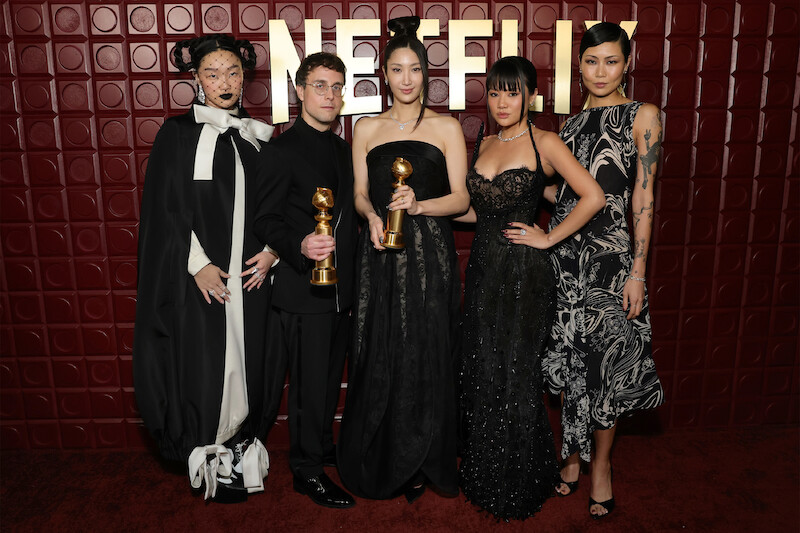 Audrey Nuna, Mark Sonnenblick, Ejae, Rei Ami and May Hong stand in front of a red backdrop. 