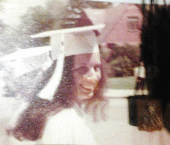 Marliz graduating high school, not long before moving to California.