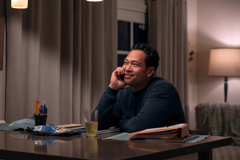Eugene Cordero as Joel takes a phone call in Season 1 of 'A Man on the Inside'