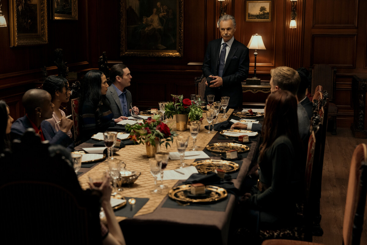 ‘The Fall of the House of Usher’ cast sitting around a dinner table.