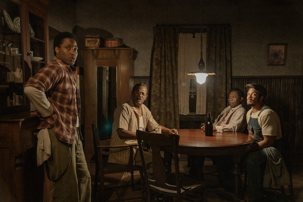 John David Washington as Boy Willie, Samuel L. Jackson as Doaker Charles, Michael Potts as Wining Boy, and Ray Fisher as Lymon in ‘The Piano Lesson.’