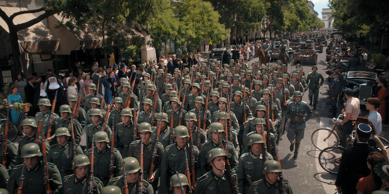 Row of soldiers marching down the street