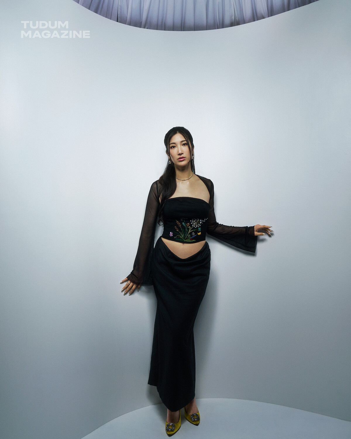 EJAE of KPop Demon Hunters wearing black dress
