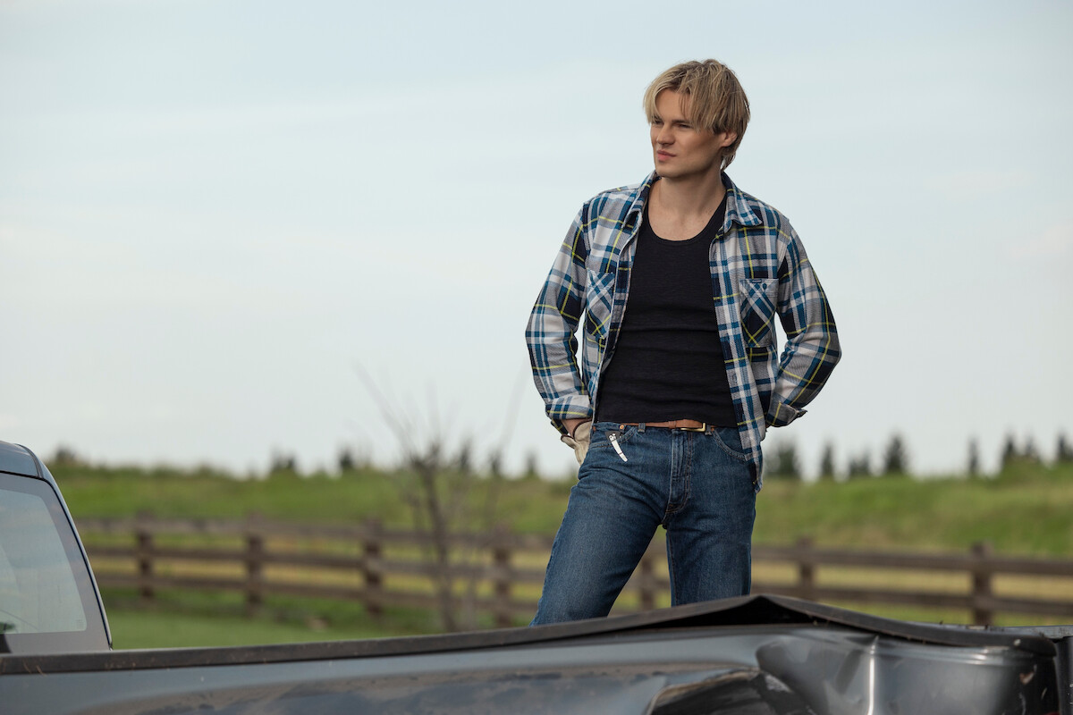 Noah LaLonde as Cole standing in a rural environment in ‘My Life with the Walter Boys’ Season 2.