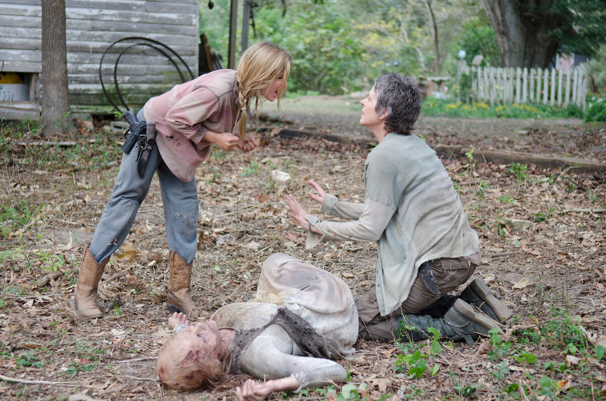 Carol argues with Lizzie over a dead zombie. 