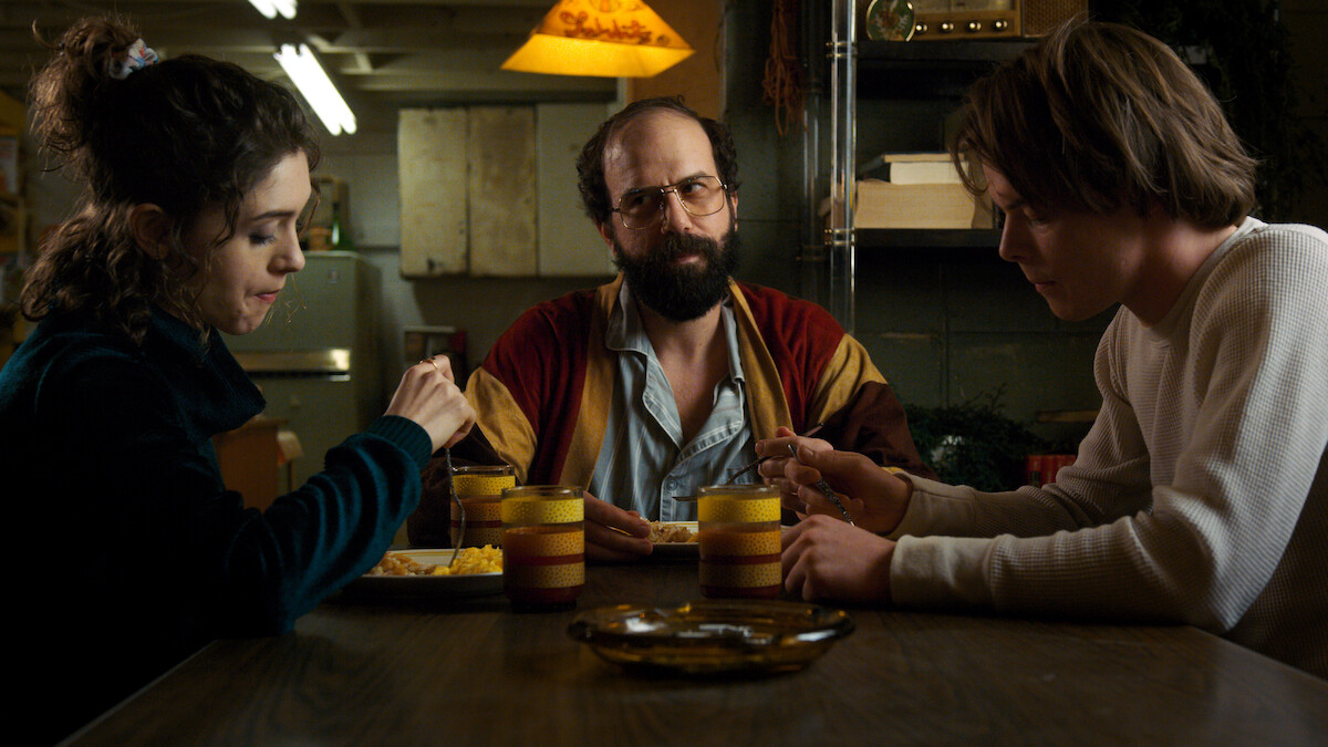 Natalia Dyer as Nancy, Brett Gelman as Murray, and Charlie Heaton as Jonathan in ‘Stranger Things’ Season 2.