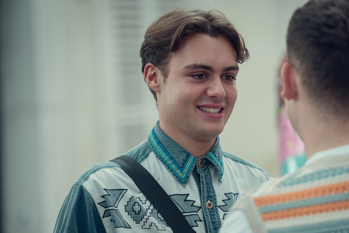 Bradley Riches as James smiles in Season 2 of ‘Heartstopper.’