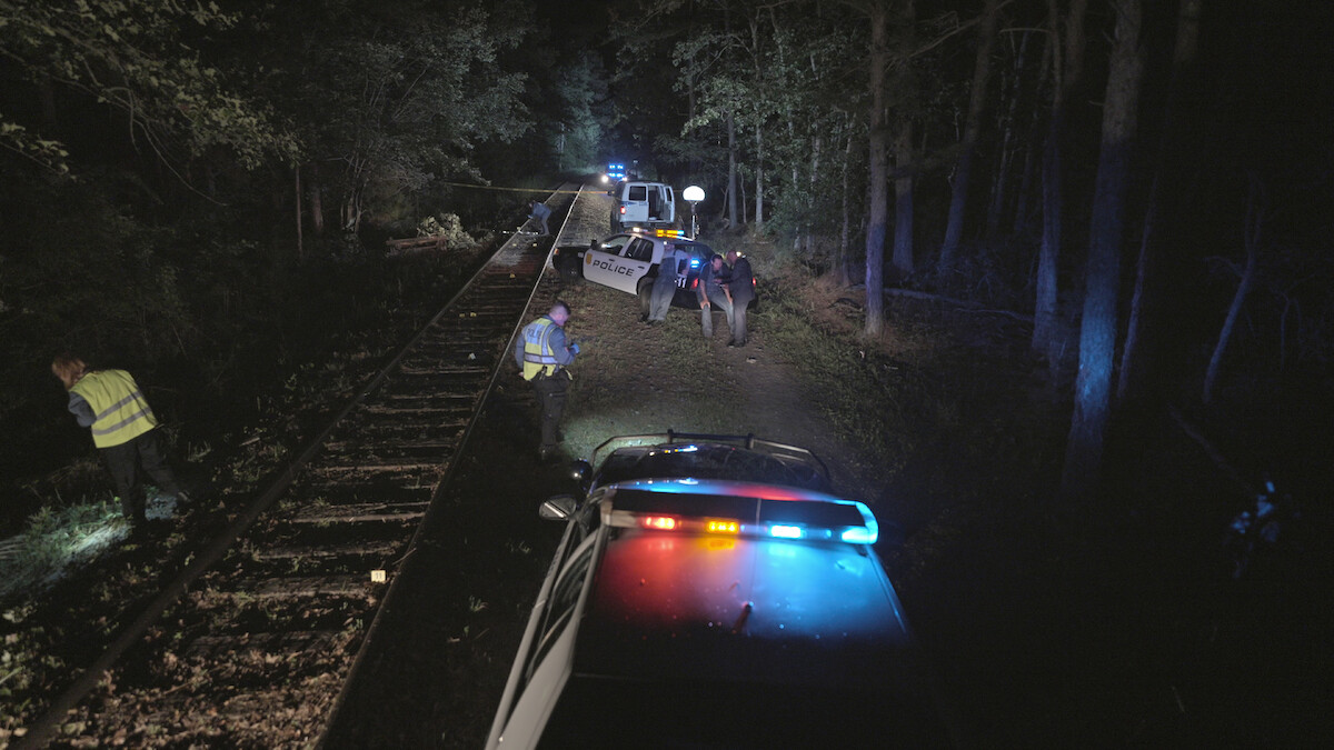 Police cars at a crime scene.