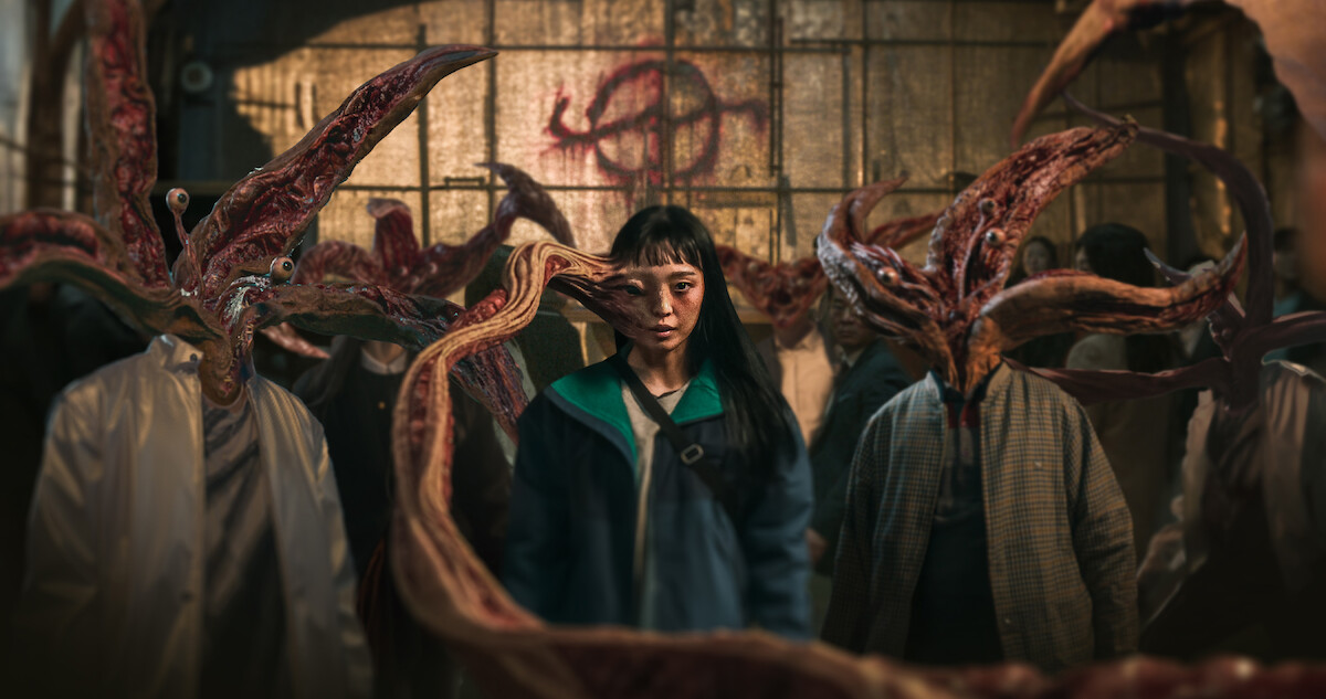An tentacle-like appendage grows from a woman's head in season 1 of 'Parasyte: The Grey'