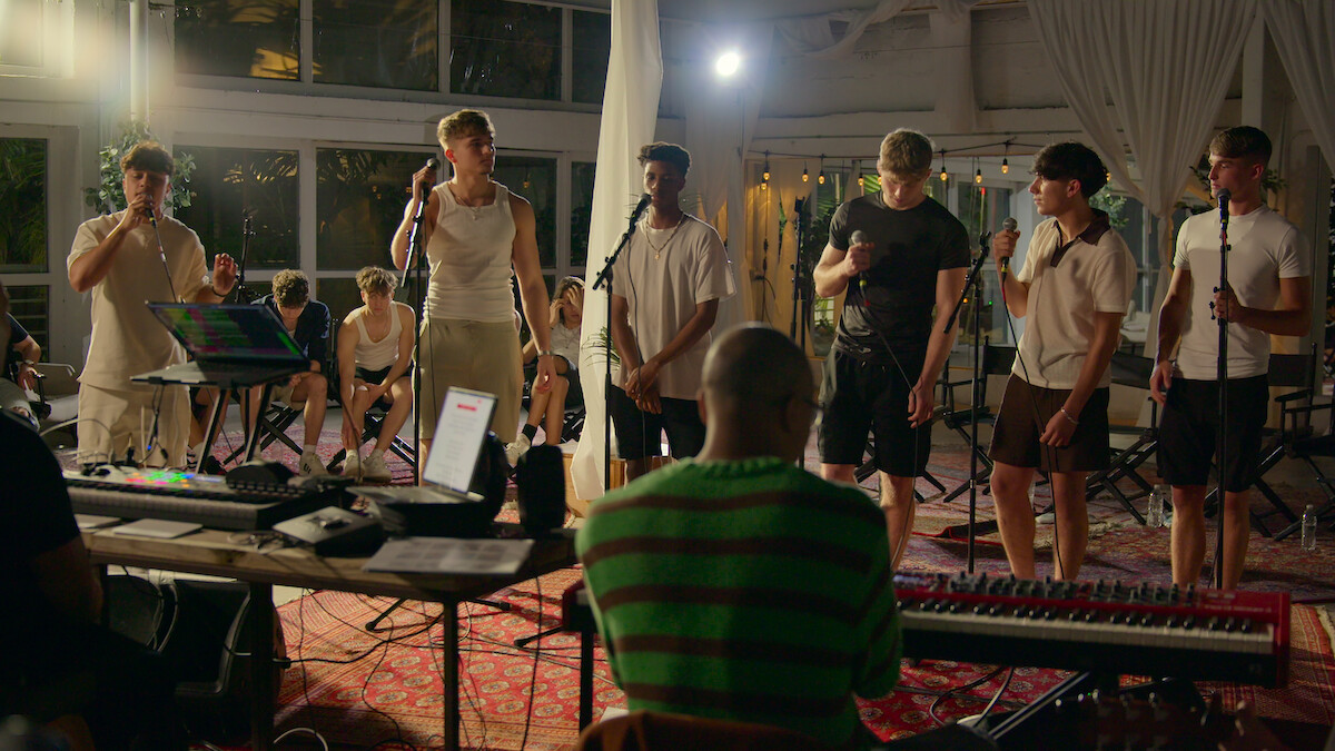 Group of singers perform.