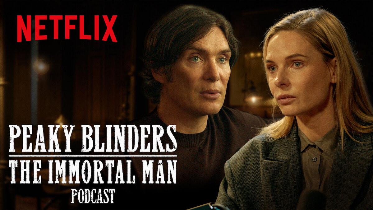 Two serious people sit indoors, warmly lit, in a conversation setting. The Netflix logo and "Peaky Blinders: The Immortal Man Podcast" text is displayed prominently in white across the image.