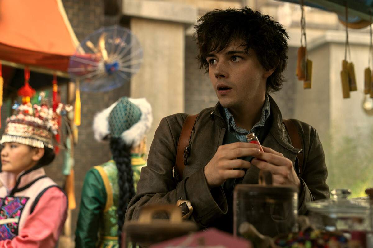 Jack Wolfe in an outdoor market as Wylan 