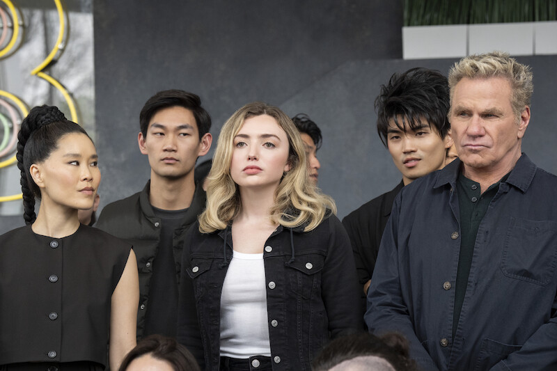 Alicia Hannah-Kim as Kim Da-Eun, Daniel Kim as Yoon, Peyton List as Tory Nichols, Brandon H. Lee as Kwon, and Martin Kove as John Kreese strike menacing glares in Season 6, Part 2 of 'Cobra Kai'
