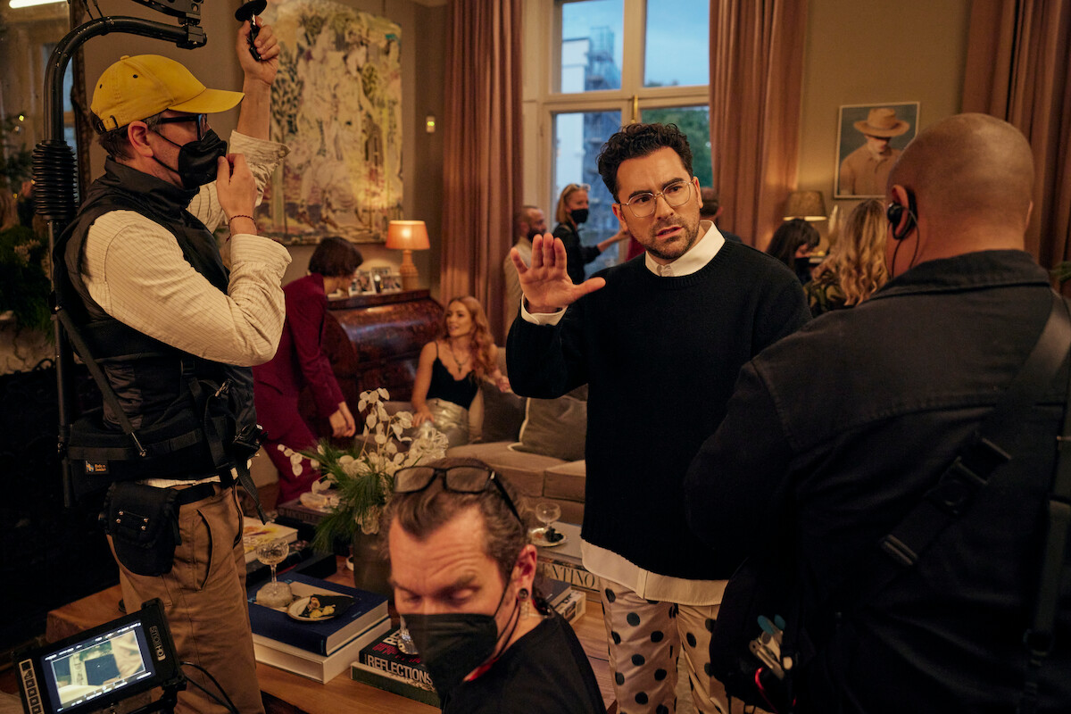Daniel Levy with crew members on the set of ‘Good Grief’.