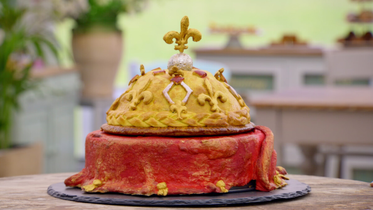 A pie backed like a monarch's crown, filled with chicken curry